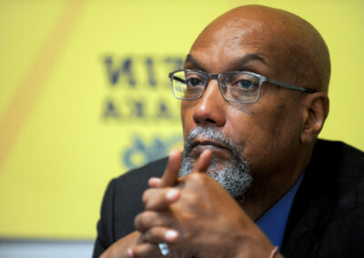 Ajamu Baraka, African man with glasses and hands joined
